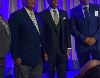 Dr. Tyrone Taborn (left) with NYC Mayor Eric Adams (center)