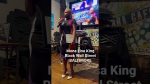 Mona Lisa King recognized with a Joe Manns Black Wall Street Award at Terra Cafe