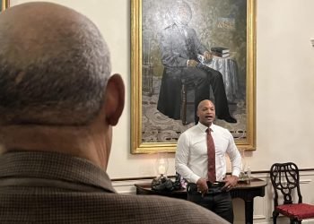 Over the shoulder of Senior Journalist Charles Robinson of MPT as he listens to Gov. Wes Moore yesterday at Government House, where the Governor lives with his family.