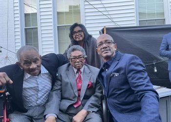 Peggy Morris (standing), Dr. Wilbert Wilson (L), Tommie Broadwater (center), & Doni Glover (R) at Black Wall Street PRINCE GEORGE'S COUNTY at Olde Towne Inn in Upper Marlboro.