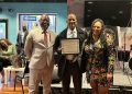 Doni Glover, Publisher of BMORENews.com, recieves Joe Manns Black Wall Street Award by the West North Avenue Development Authority