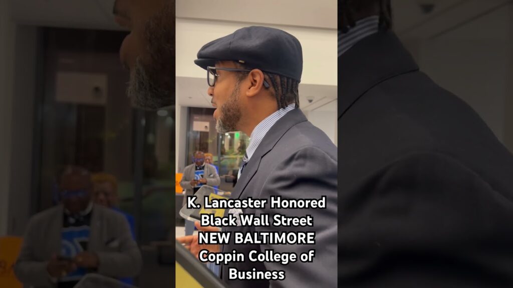 Larry introduces his wife, K. Lancaster, at Black Wall Street NEW BALTIMORE Coppin State University