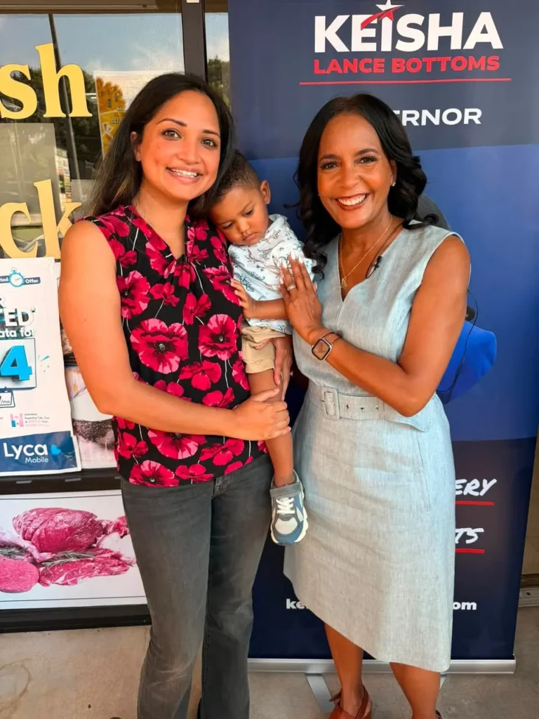 Former Georgia State Sen. Nabilah Parkes, pictured with her child and Democratic gubernatorial nominee Keisha Lance Bottoms, supports Bottoms’ plan to lower grocery costs for Georgia families.